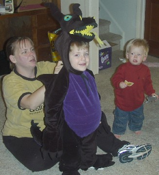 photo of Alex putting the dragon costume on