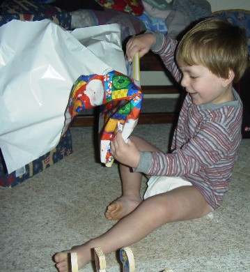 photo of Alex opening a present
